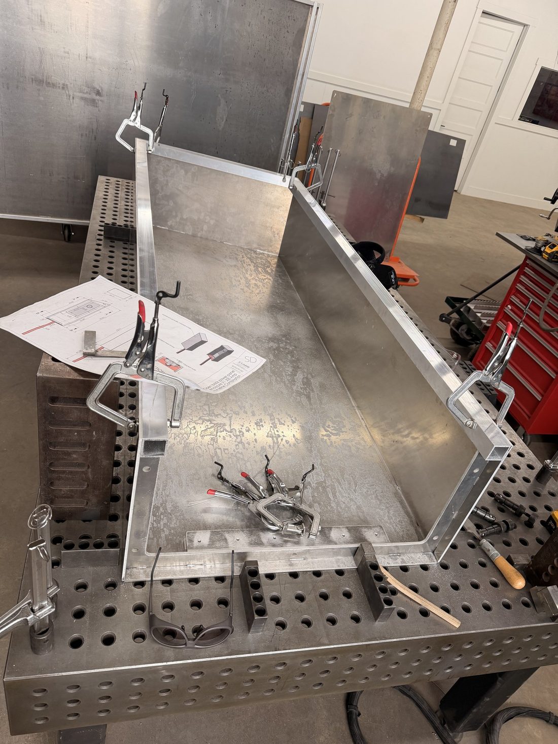 Fabricated aluminum enclosure fixtured on a precision table