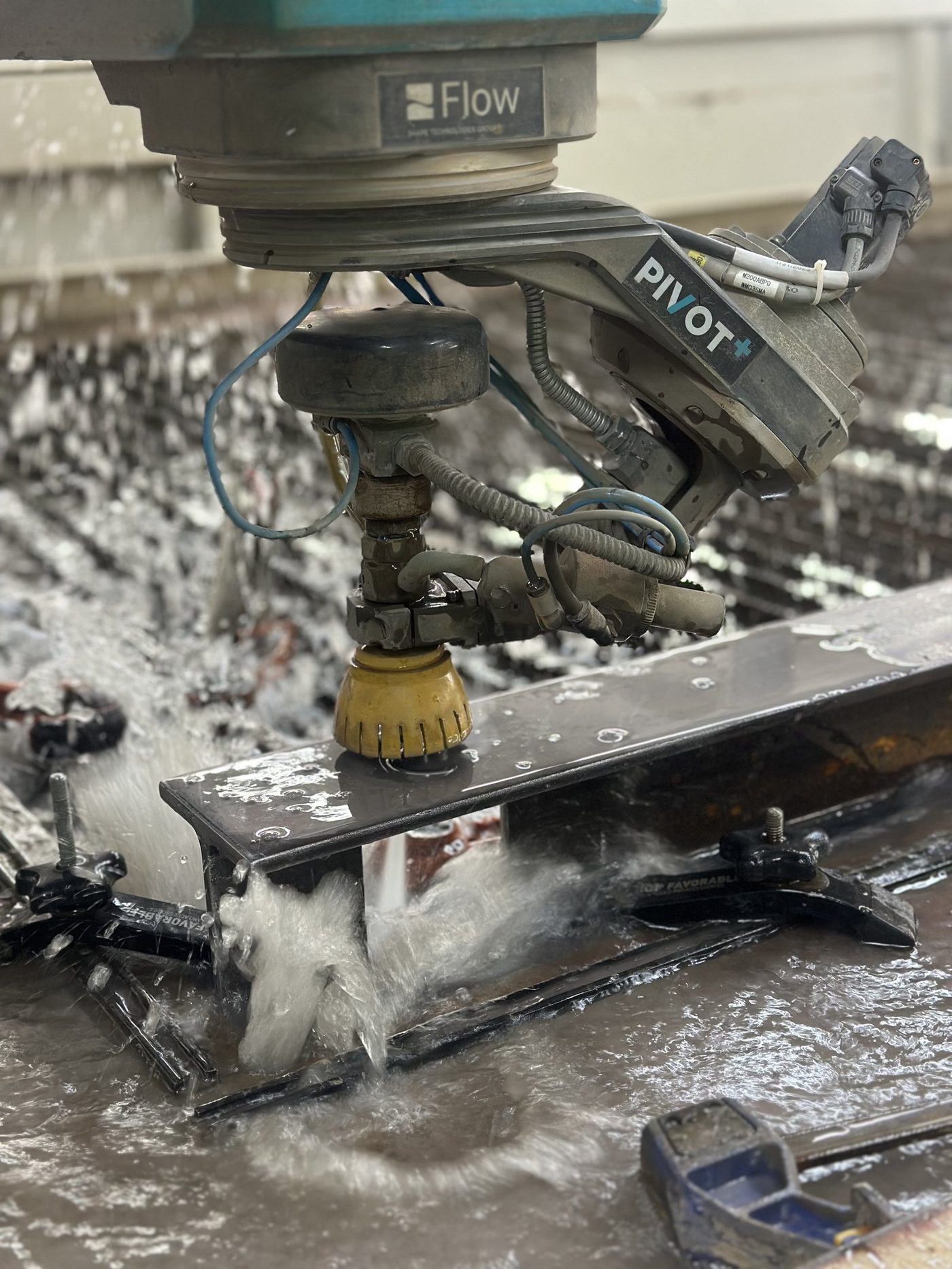 Five-axis waterjet head cutting steel