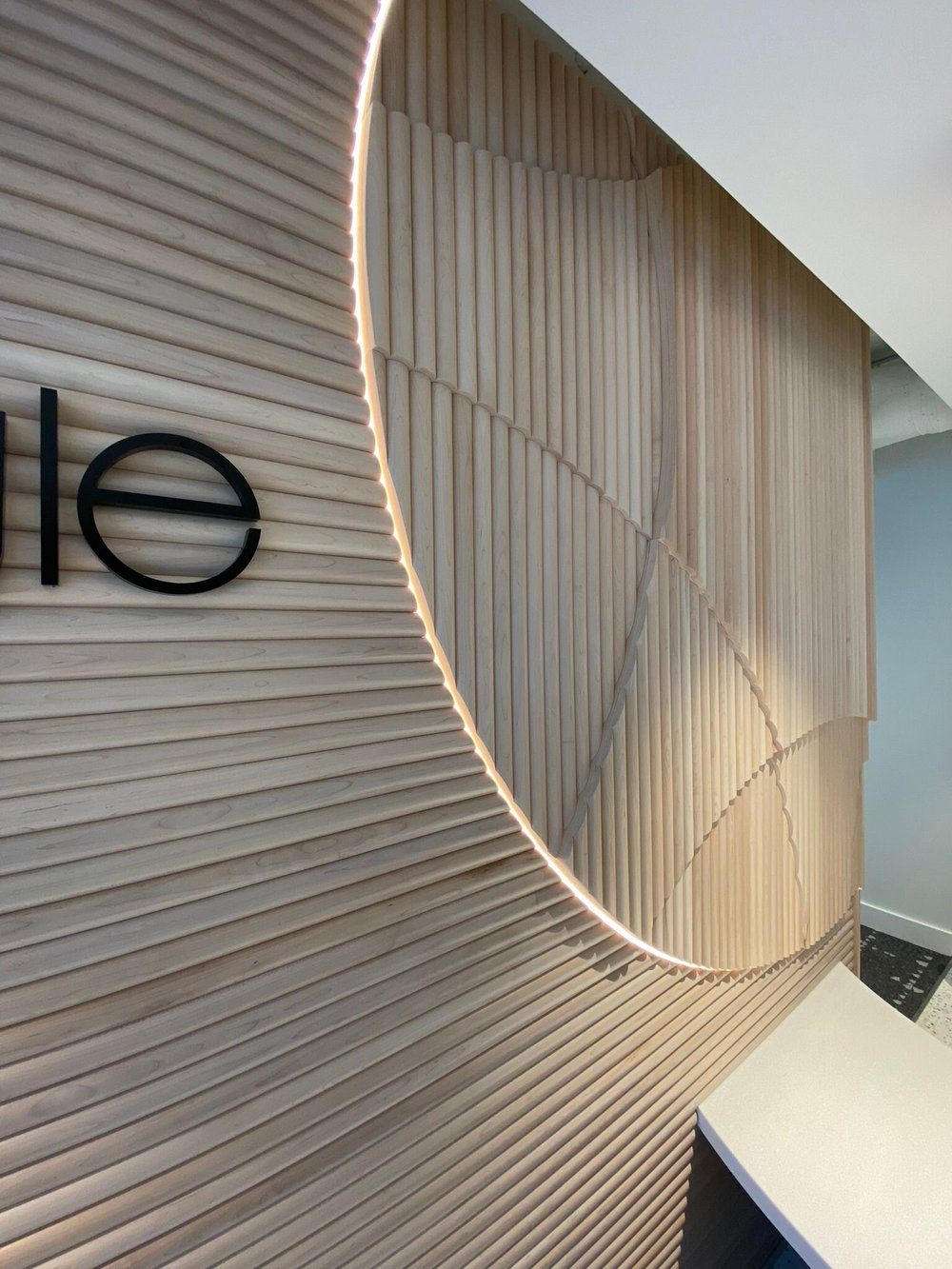 Slat wall with integrated light, office