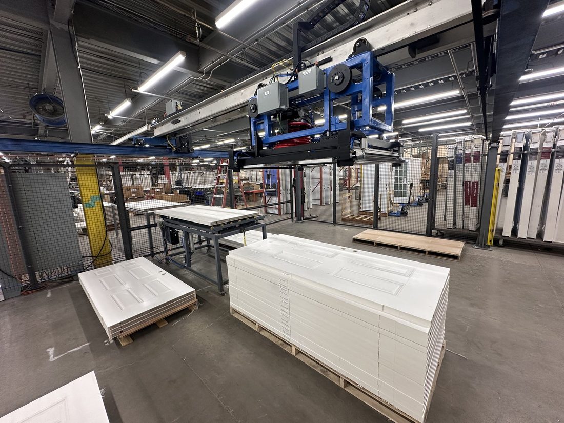 Gantry system with integrated guarding over production stacks